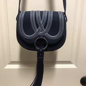 Tory Burch small crossbody. Blue suede with white trim design.